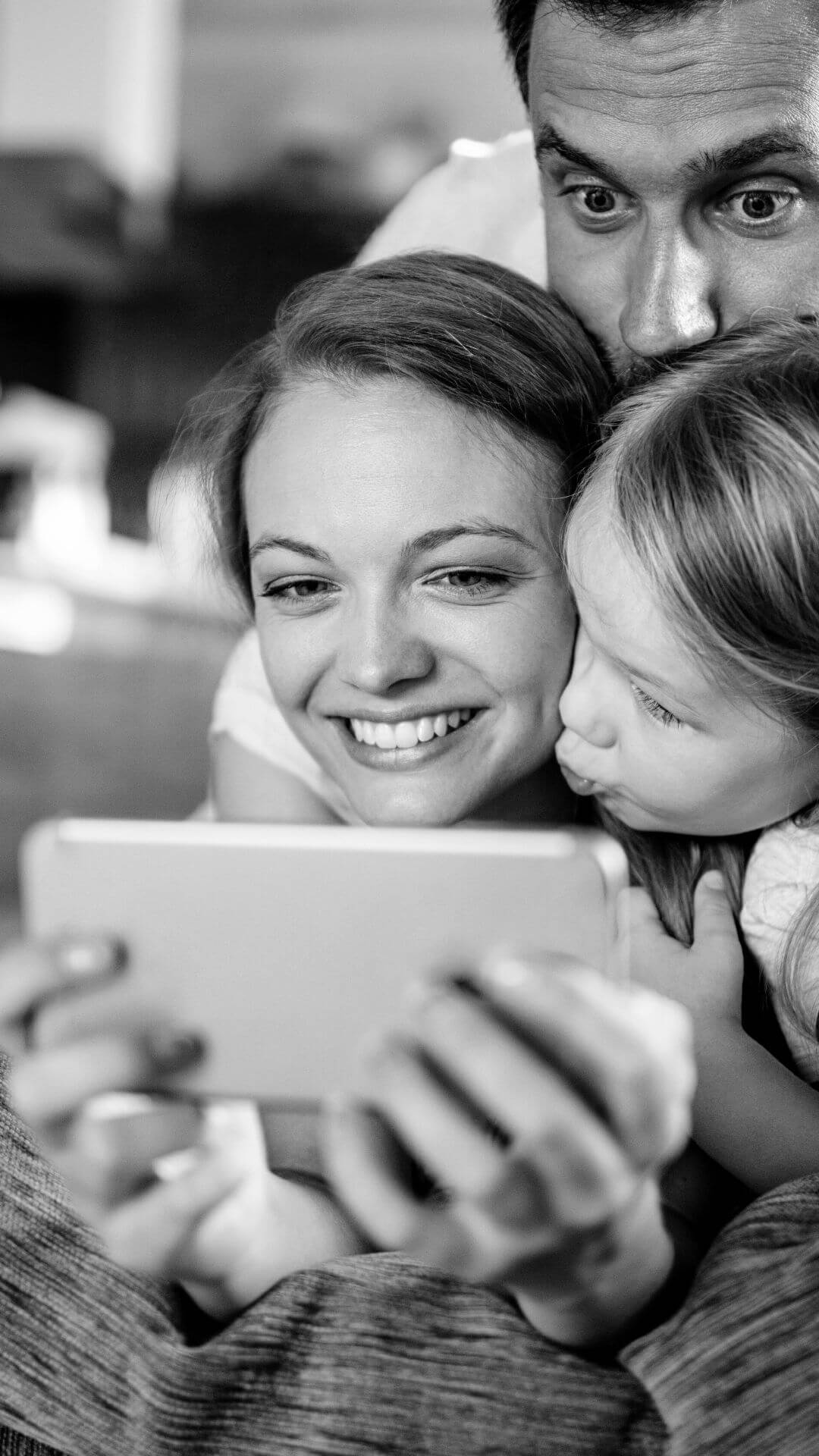 Illustrative stock photograph of a family using a tablet together